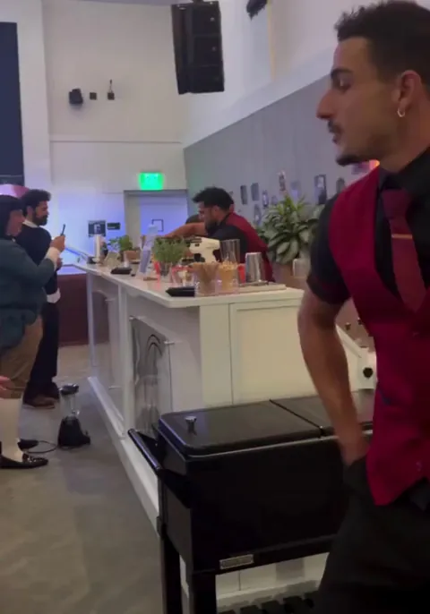 An Italian bartender in L.A. shows off his flashy impressive skills with a smooth bar trick