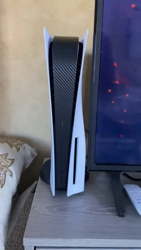 Decided on the Black Carbon Skin for the Ps5 faceplate to stop the scratching, and love how it turned out. Thoughts?