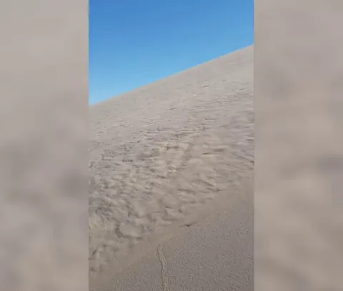 "Singing Sand" is a phenomenon where sand creates a loud, low rumbling noise, caused by the vibrations of grains rubbing against each other