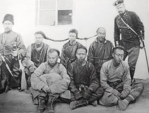 Russian Security Guard officers of the Chinese Eastern Railroad with a group of arrested Manchurian honghuzi (1900)