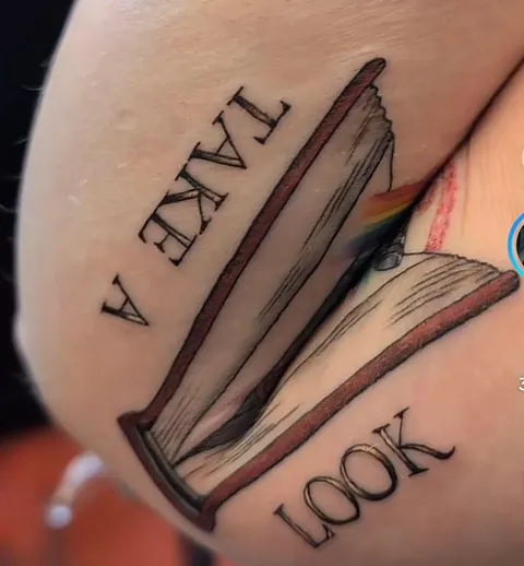 Awesome book tattoo by Witch of Waste in Wyoming. Who gets the reference???