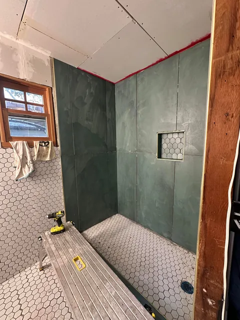 Turned my 1903 three car garage into 1/2 garage and 1/2 bedroom and bathroom my