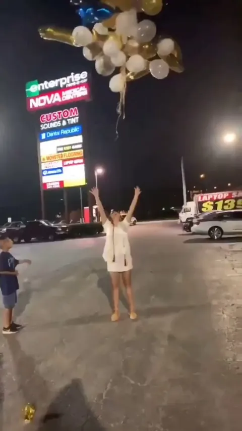Girl releases balloons into power lines