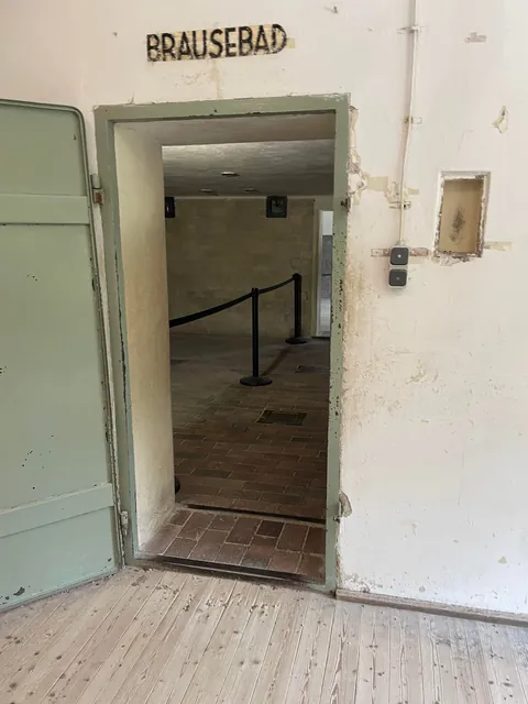 Inside Dachau’s crematorium building, the gas chamber is labeled ‘Brausebad’ (‘Showers’).