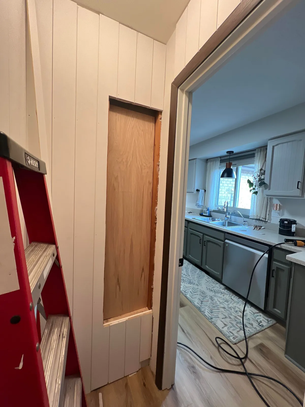 Reclaimed unused coat closet for pantry expansion