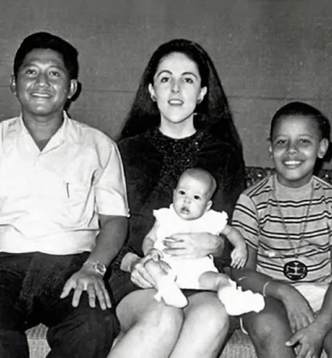 A young Barack Obama with his mother Ann Dunham, stepfather Lolo Soetoro, and half-sister Maya in Indonesia, circa 1970.
