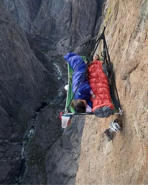 hanging “beds” are called portaledges.. collapsible platforms used by climbers during multi-day ascents