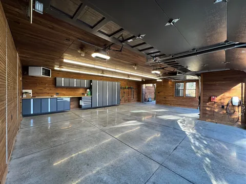 Just had the time to Spring Clean and since we finally finished the concrete floors and got cabinetry installed, I wanted to share! Here is our new, 1920s-styled garage in Detroit with a custom attic elevator, our architectural drawings and images of the original 1927 garage we replaced.