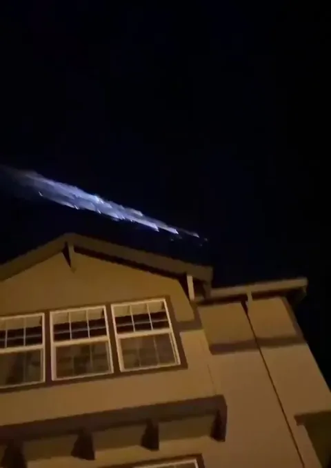 Dog walker captured the moment a rocket broke apart in the earth atmosphere