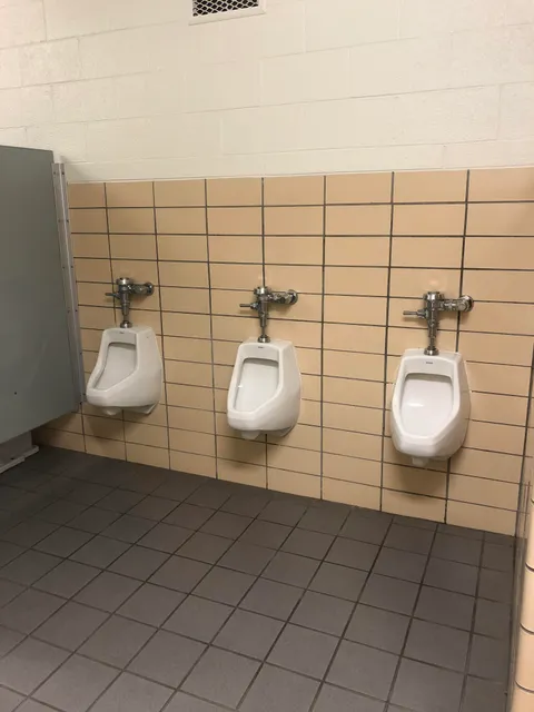 Our school district says it would cost $1,500 to put in two dividers. Teachers and students use this restroom.