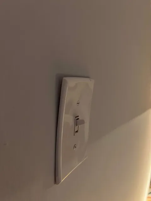 Multiple Light Switch Covers and Outlet Plates Warped at Once — What Could Cause This?