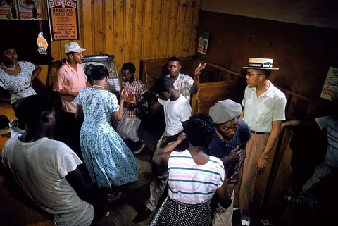People enjoying a good time in a small "Juke" party, South Carolina, 1956. Kodachrome shot. I think this is a small diner establishment.