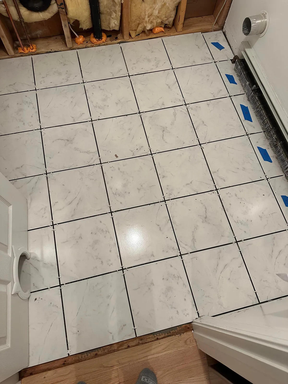 Washer flooded my laundry room so I learned how to tile.