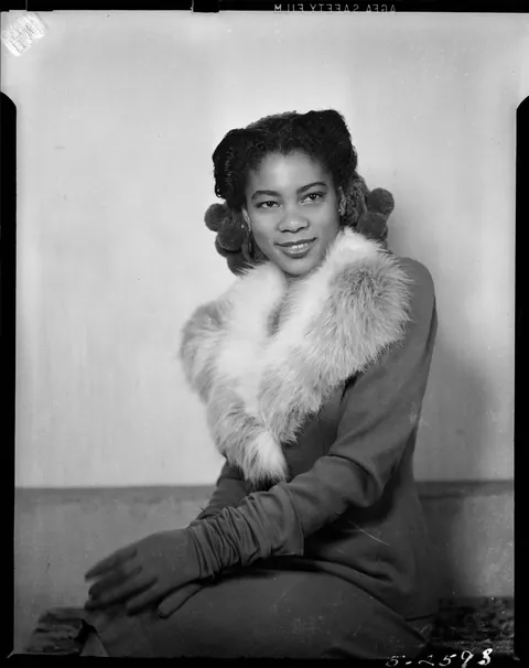 Young lady poses for her solo professional studio photo and then with her boyfriend, Pennsylvania, circa 1940s