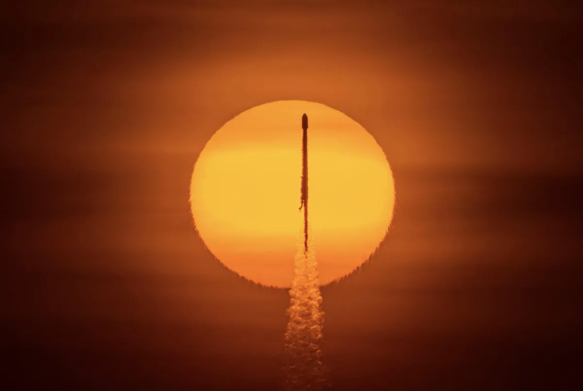 I photographed a SpaceX Falcon 9 rocket transiting the sun during its recent launch of 60 Starlink satellites