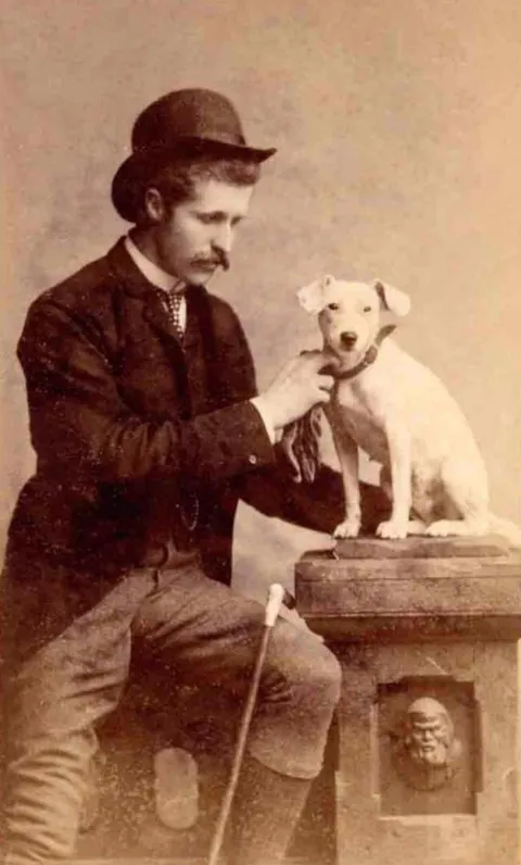 Gentleman pose for photos with their beloved pups, circa 1880-1900