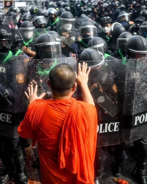 Monks clashing with police in Bangkok riots, November 2022