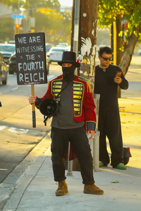 The Tesla Diner in Hollywood threw a Halloween party tonight… so the protesters outside did too [OC]