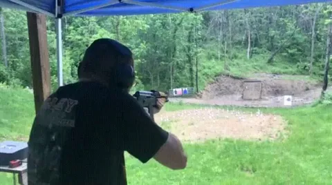 AK-47 muzzle blast deflecting rain