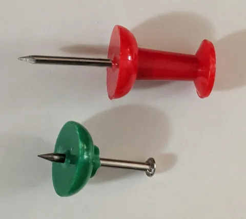 Pushpins are just nails dressed up in plastic for functionality.