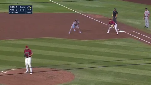 Red Sox Trevor Story looks to be picked off first but evades the tag and is safe at second. He is credited with the steal and is now 27 for 27 on the season