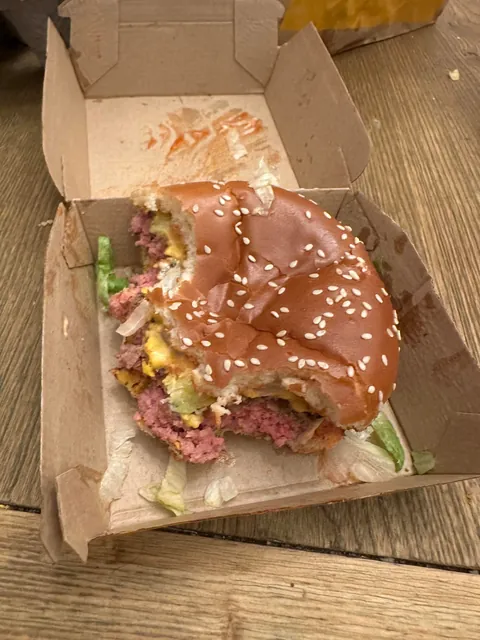 And this was the replacement burger after their shitty bag dropped all the food onto the drive thru. Never bite in the dark, guys.