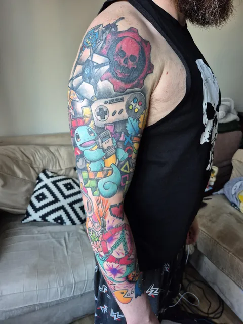 My gaming themed patchwork sleeve tattoo