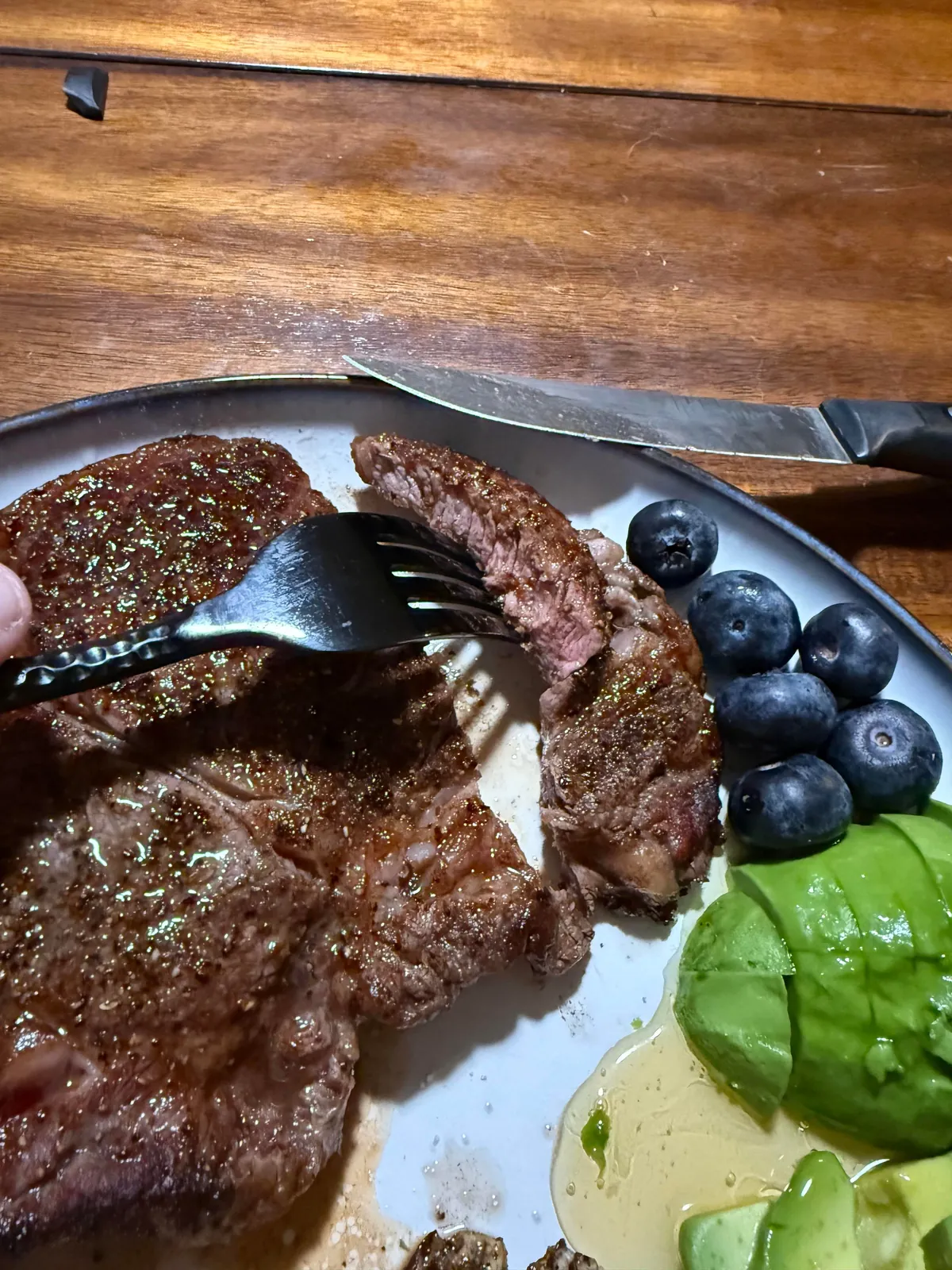 [Homemade] Ribeye with eggs, avocado, and blueberries.