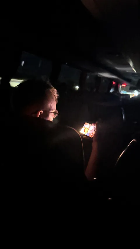 This guy on a overnight bus with max brightness and no headphones