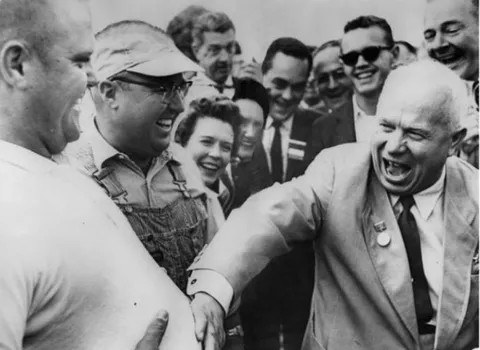 Nikita Khrushchev rubbing the belly of an American farmer during Soviet visit to Iowa, 1959