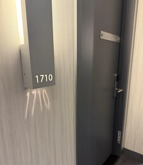 The hotel room’s number is displayed 4 times