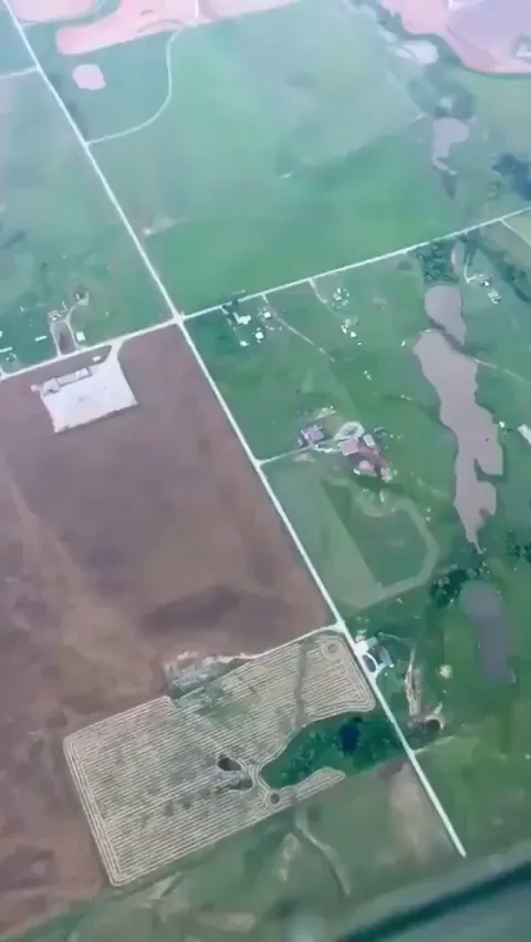 A pilot flying around a tornado