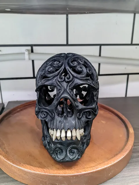 I made a skull carving from ebony wood, the teeth are made from cow bone