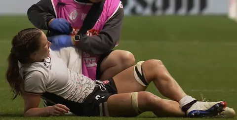 Canadian player Caroline Crossley with a calf cramp at the Women's Rugby World Cup