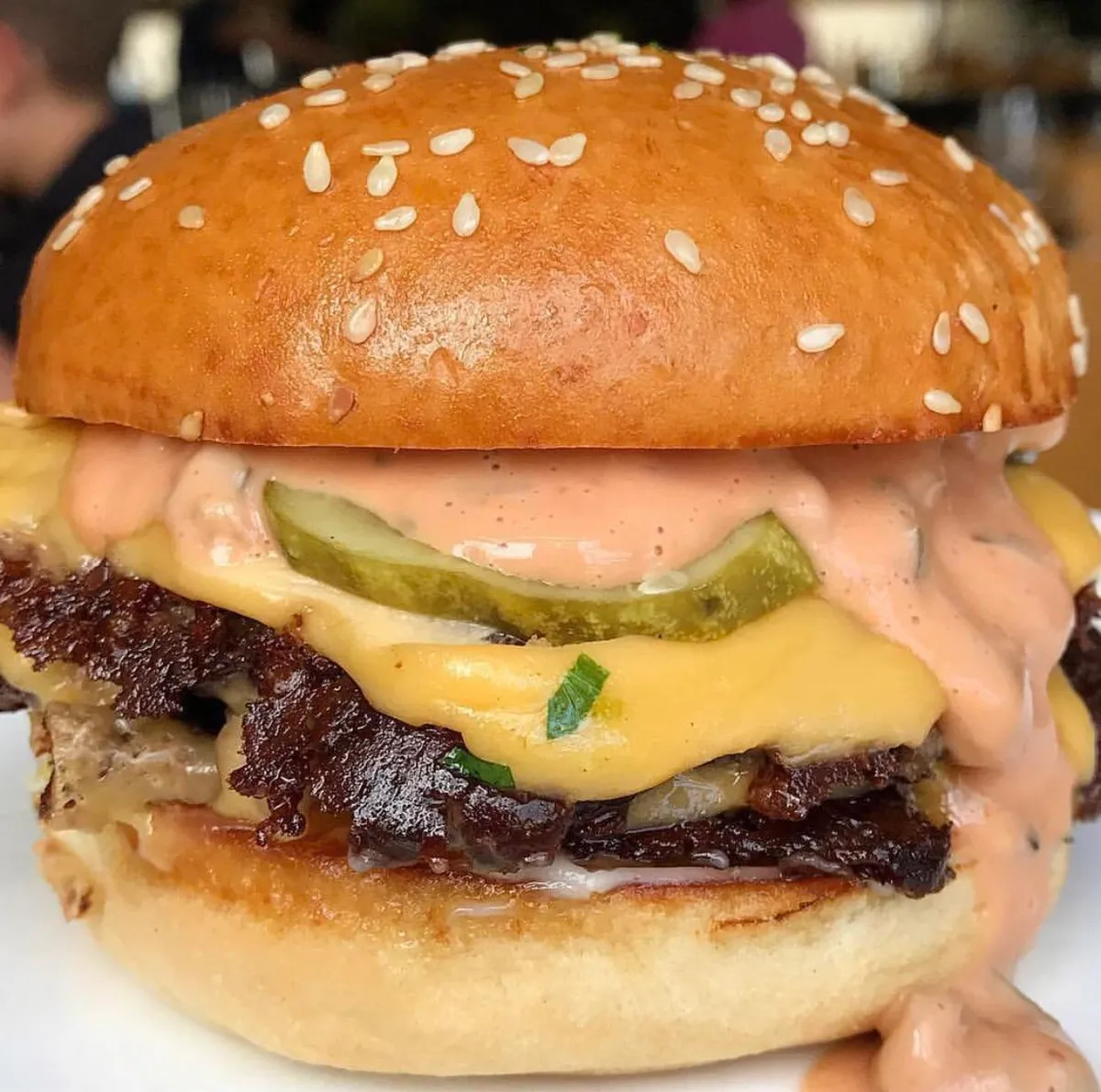 A simple man’s cheeseburger with special sauce and a pickle.