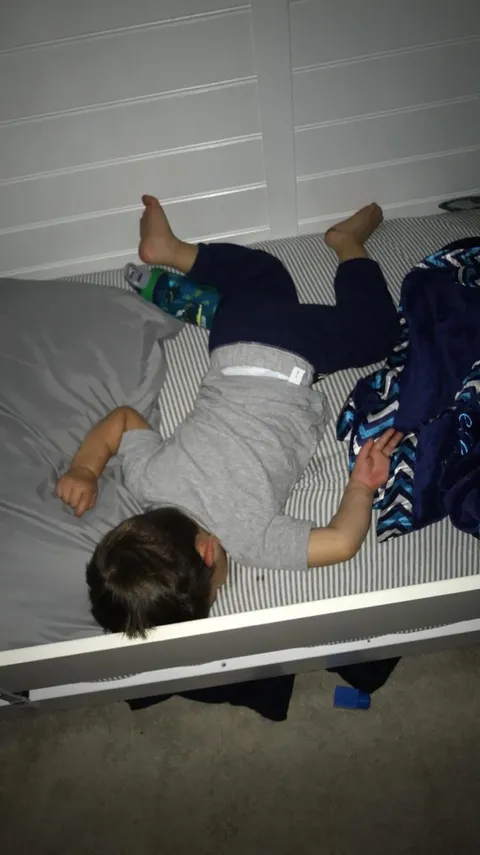 My kid sleeps like he fell down in Family Guy.