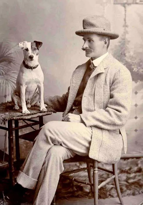 Gentleman pose for photos with their beloved pups, circa 1880-1900
