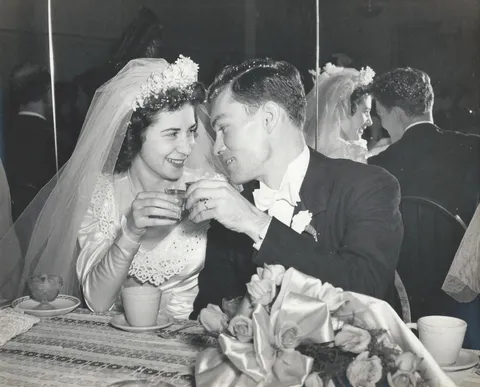 My grandparents' wedding in 1948. I just love his expression!