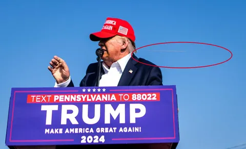 Remarkable photo showing bullet from PA rally assassination attempt today flying past Donald Trumps head.