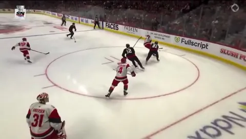 Alexander Nikishin out cold, needing assistance off the ice, after huge hit from Tyler Kleven.