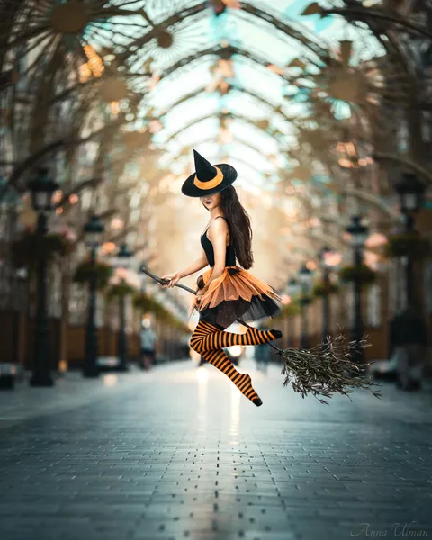ITAP of a ballerina with a broomstick in the middle of the street in Malaga
