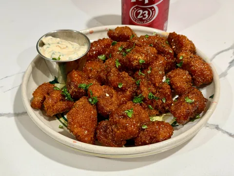 [homemade] boneless wings or saucy nugs or popcorn chicken or something.