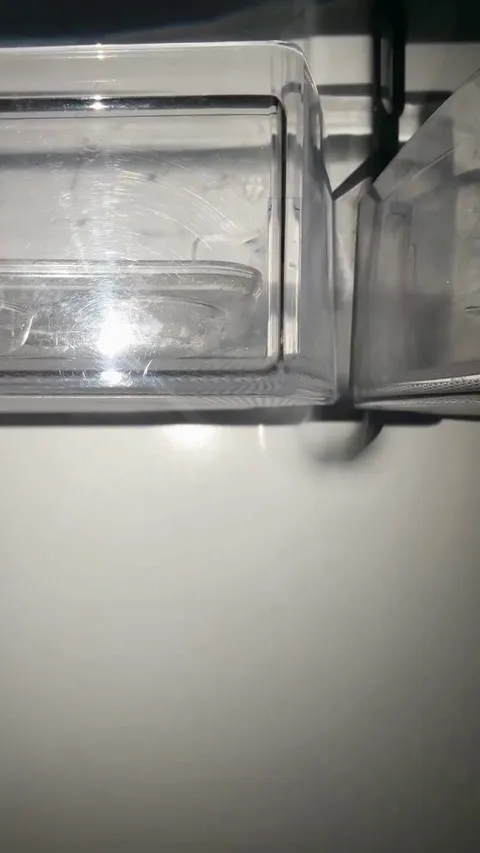 Cute girl looks in the fridge for a snack