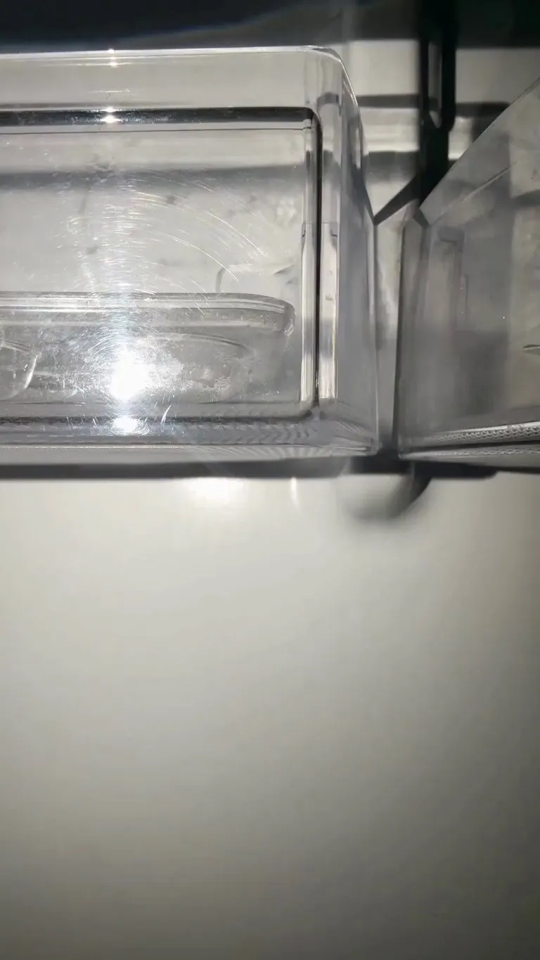 Cute girl looks in the fridge for a snack