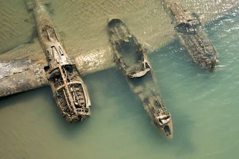 The remains of a crashed P-38 Lightning on a beach in Wales