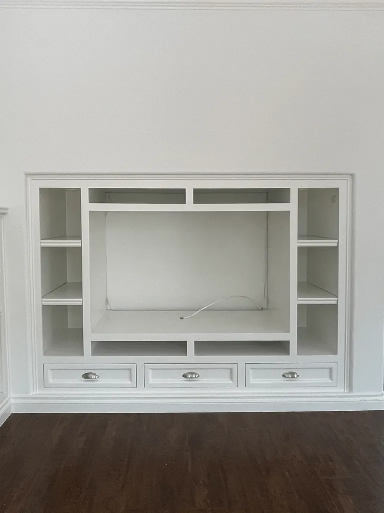 We transformed our 90s entertainment center in a reading nook