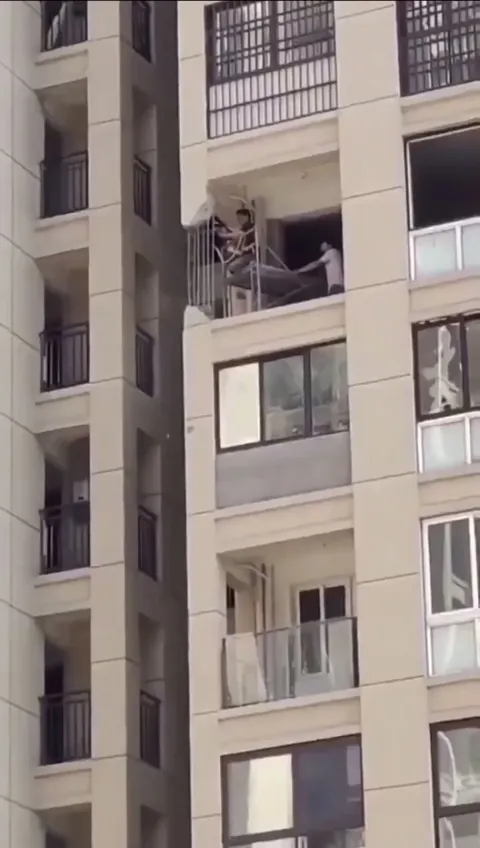 Resident cuts a structural column on the 6th floor of a 20-story building to improve the view