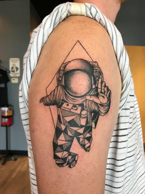 Geometric astronaut done by Maddy at Deaf Dog Ink in Saint Louis, MO