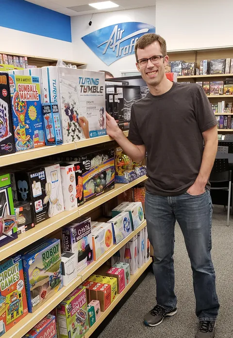 As a kid, I visited this store *every* chance I got. Today, they're carrying a game I made. A year after our big Kickstarter and quitting my job, this is my "made it" moment. Thank you Reddit! This is a dream come true.