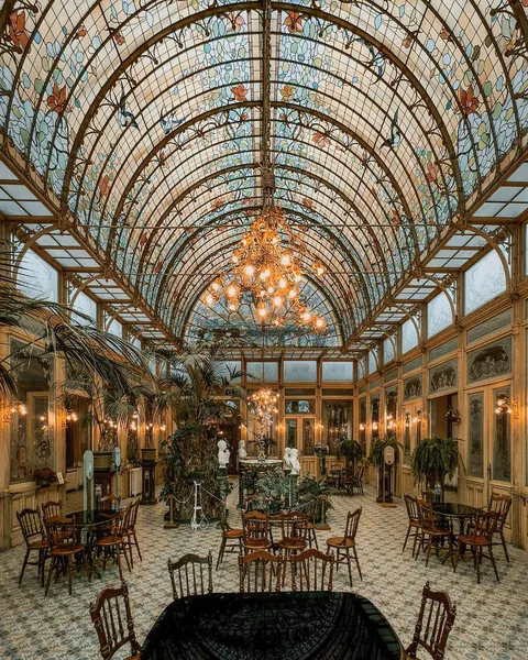 1900 Art Nouveau Winter Garden of the Ursulines Institute with a stained-glass ceiling, town of Onze-Lieve-Vrouw-Waver near Mechelen, Belgium.